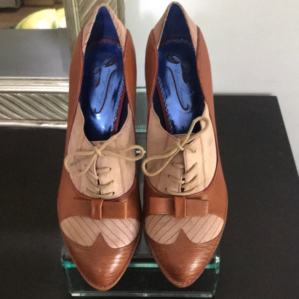 Brown and Tan Heels with Brogue Detailing. Never worn.non-pet non-smoking home.